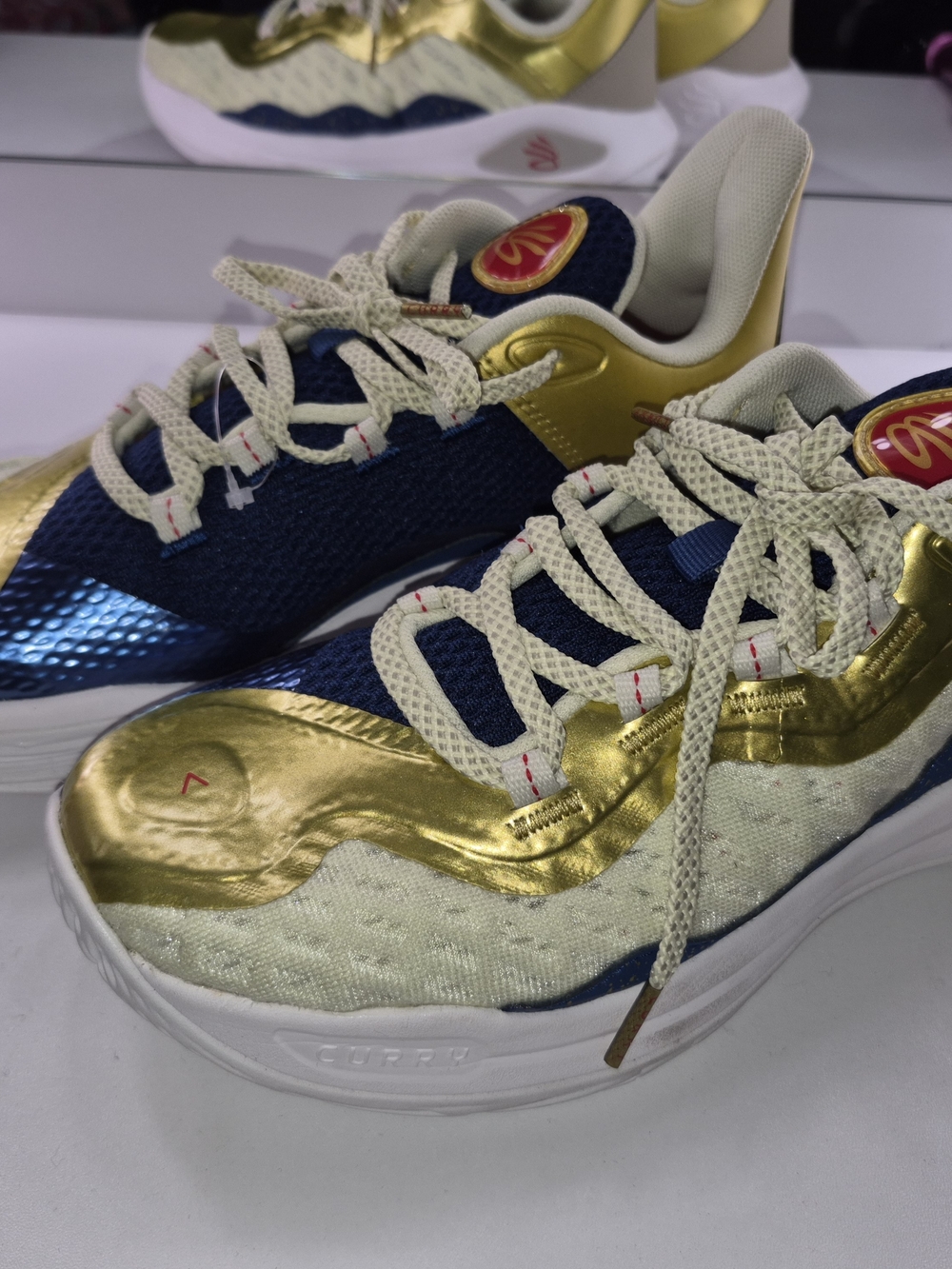 Under Armour Gold and Navy Athletic Shoes